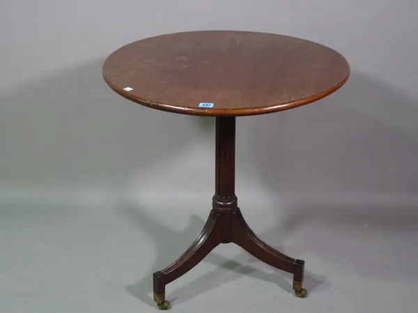 An early 19th century mahogany occasional table, the circular top on fluted column and three downswept supports, 65cm diameter x 69cm high.   L7