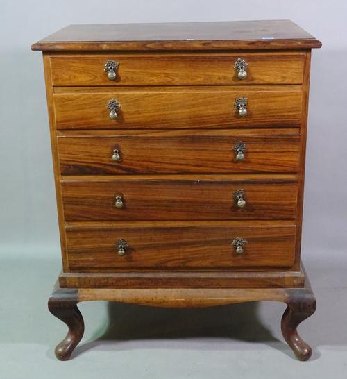 An early 20th century Anglo Indian hardwood chest of five long graduated drawers, with shaped lower frieze on squat cabriole supports, 86cm wide x 104