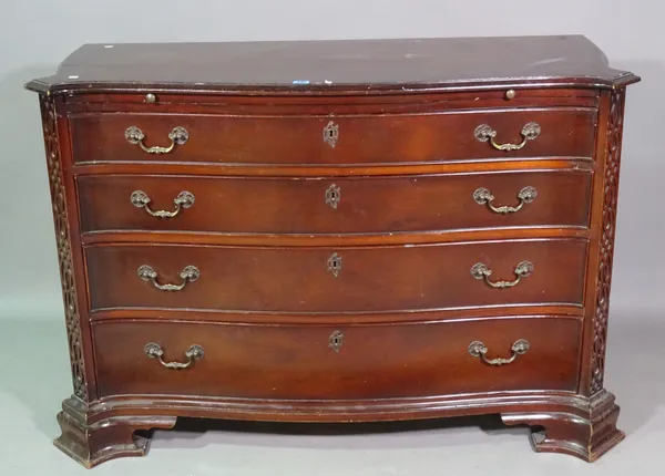 A mid-18th century style mahogany serpentine chest of four long graduated drawers, flanked by blind fret corners, on outswept shaped bracket feet, 124