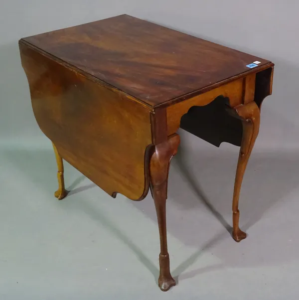 An early 20th century mahogany drop flap table with shaped top and stylized hoof feet, 80cm wide x 70cm high.     E5