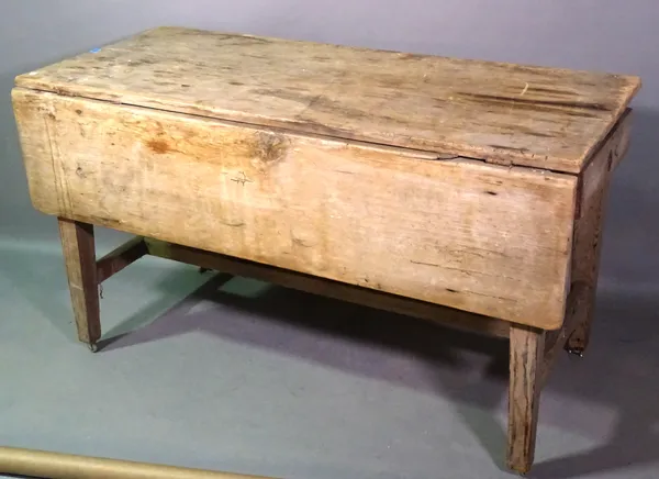 An early 20th century pine work table with single drawer, 140cm wide x 78cm high.   C9
