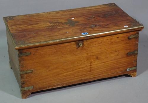 An early 20th century teak brass bound trunk, 73cm wide x 35cm high.   H7