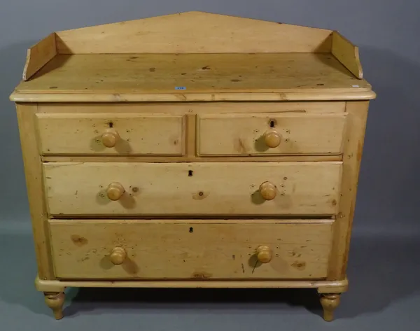 An early 20th century pine chest of two short and two long drawers with galleried top, 105cm wide x 100cm high.   BAY 2