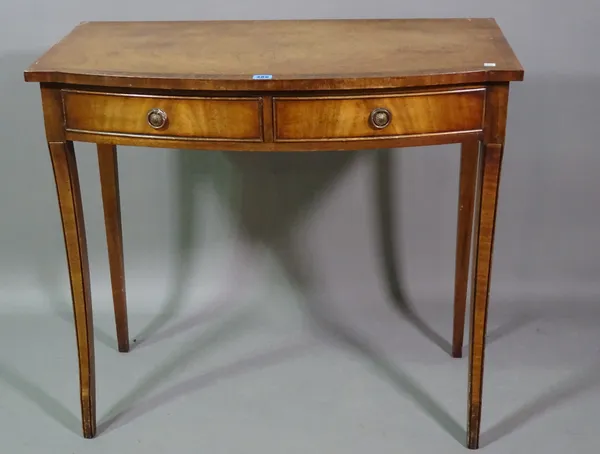 A 19th century mahogany bowfront two drawer side table on sabre supports, 85cm wide x 78cm high.   A4