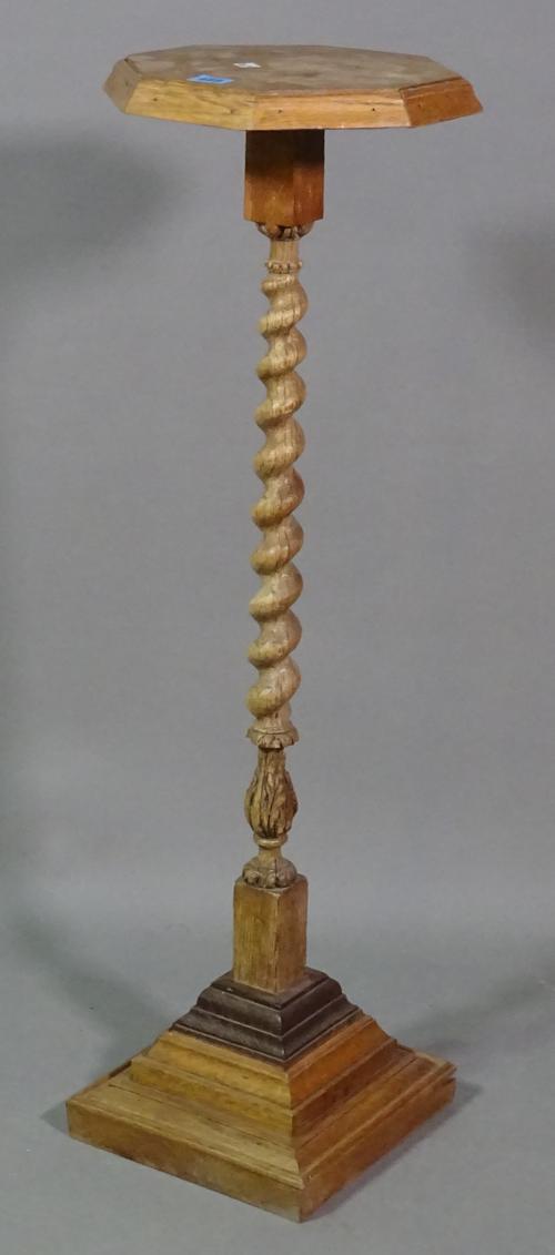 An early 20th century oak jardiniere stand on barley twist column and plinth base, 30cm wide x 95cm high.   E5