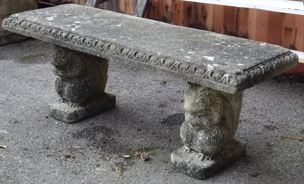 Garden statuary comprising; a 20th century reconstituted stone bench, the pedestals formed as squirrels, 116cm wide x 57cm high.   OUT