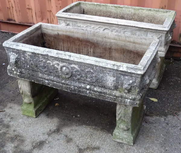 Garden statuary comprising; an pair of early 20th century reconstituted stone troughs on pedestal bases, 90cm wide x 55cm high. (2).   OUT