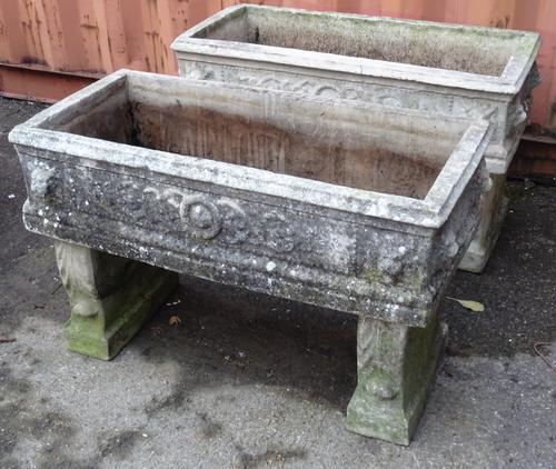 Garden statuary comprising; an pair of early 20th century reconstituted stone troughs on pedestal bases, 90cm wide x 55cm high. (2).   OUT