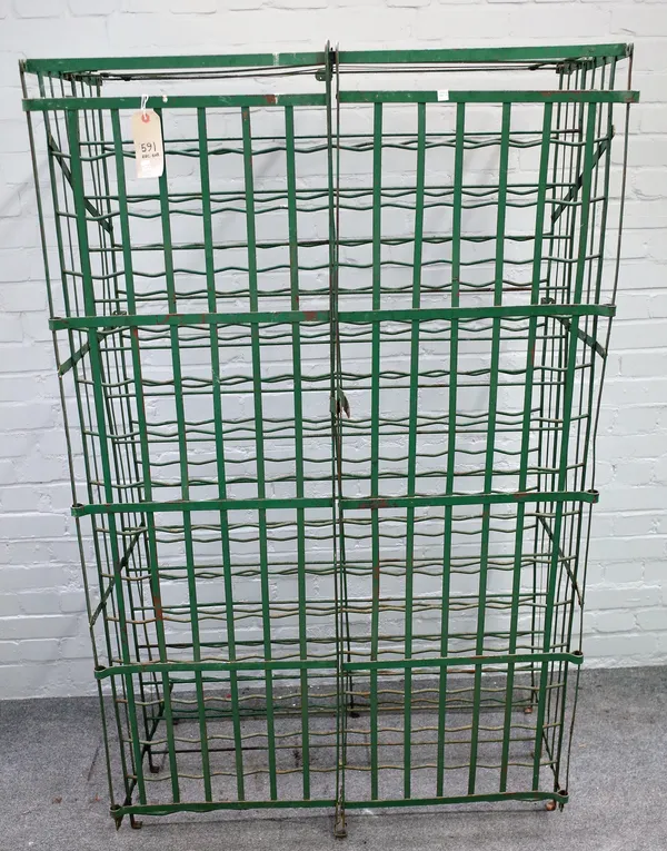 A green painted wrought iron wine rack, early 20th century, wall mounted with lockable twin hinged doors with space for over 140 bottles, 170cm high x