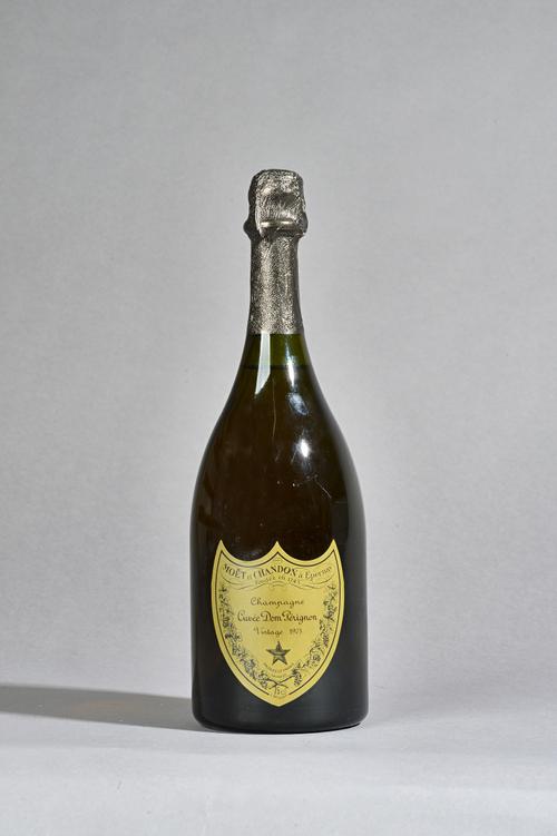 One bottle 1975 Dom Perignon vintage champagne.  Illustrated.