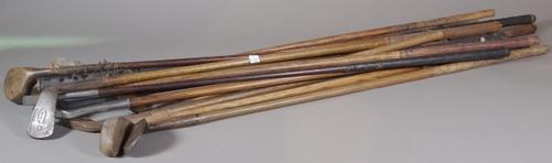 Thirteen early 20th century wooden golf clubs, to include putters and drivers, (13).   S1T