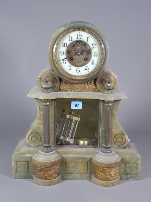 A 19th century onyx mantel clock with cherub decoration, 39cm wide x 47cm high, a 19th century black slate marble mantle clock 44cm wide x 35cm high a