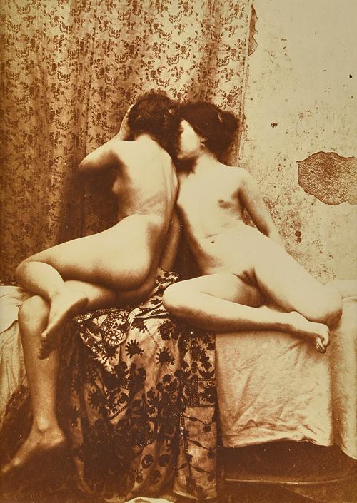 VINCENZO GALDI  (1871 - 1961)  two young female nudes sitting by a patterned curtain, 1900.  sepia toned gelatin silver print, mounted within card boa