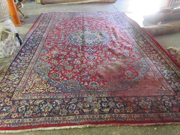 A Kashan carpet, Persian, 413cm x 274cm.  Please note that this lot is subject to VAT on the hammer