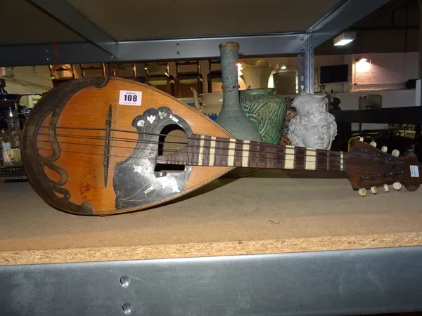 A 19th century rosewood and inlaid mandolin.  C