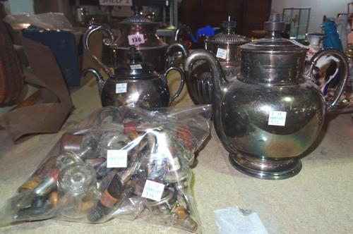 A group of five Royle's "Self Pouring" teapots and a quantity of Victorian and later bottle stoppers, (qty).  S2