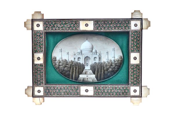 Indian School, watercolour on ivory, Taj Mahal, unsigned oval mounted in a glazed and inlaid frame, plaque 13.5cm wide. 43  Illustrated