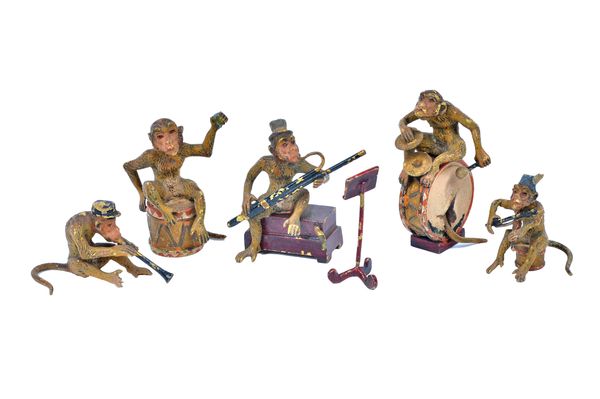 An Austrian cold painted bronze monkey band, early 20th century, comprising five monkeys playing various instruments with a sheet music stand, the tal