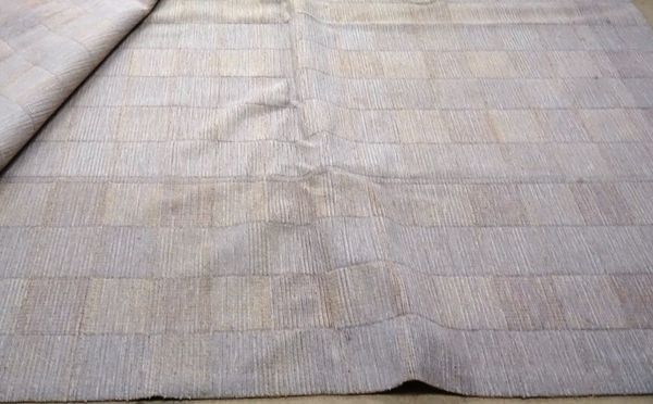 A very large machine made wool carpet by V'soske, of mottle grey and brown tiled design, 513cm x 483cm (a.f).
