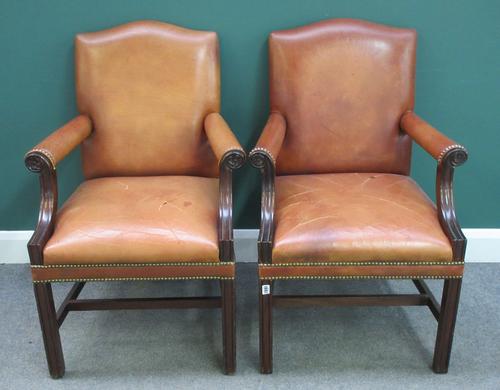 A pair of 18th century Gainsborough style open armchairs, with tanned leather upholstery on channelled square supports, 66cm wide x 100cm high. (2)