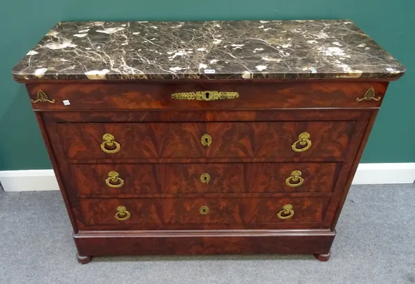 An early 19th century French gilt metal mounted mahogany commode, the marble top over four long graduated drawers, 123cm wide x 96cm high x 53cm deep.