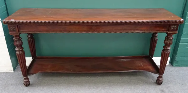 A William IV mahogany serving table, on tapering reeded columns united by concave platform undertier, 198cm wide x 93cm high x 60cm deep.