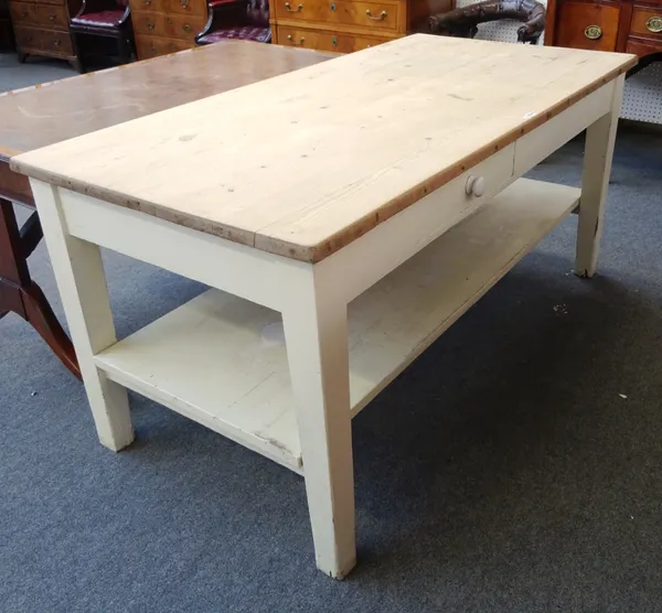 A late 19th century pine preparation table, the stripped pine top over single drawer and platform undertier, on tapering square supports, 182cm wide x