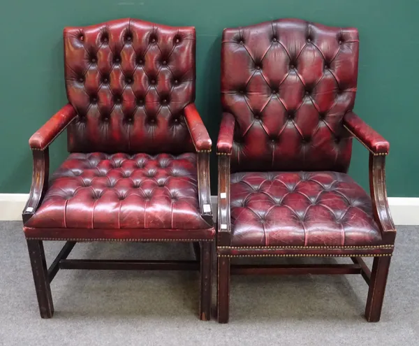 A near pair of mid-18th century Gainsborough style chairs with studded red leather upholstery on channelled square supports. 66cm wide x 101cm high, (
