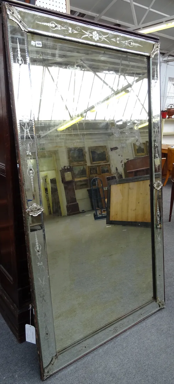 A large pair of early 20th century rectangular Venetian wall mirrors, each with raised etched border, 113cm wide x 200cm high, (2).