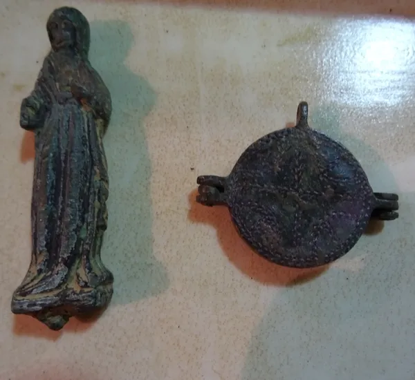 Possibly Ancient; two bronze metal detector finds, a circular mirror casing and a small figure, (2).