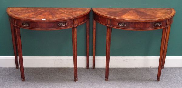 A pair of inlaid mahogany semi-elliptic side tables of George III design, each with single frieze drawers on tapering square supports, 92cm wide x 75c