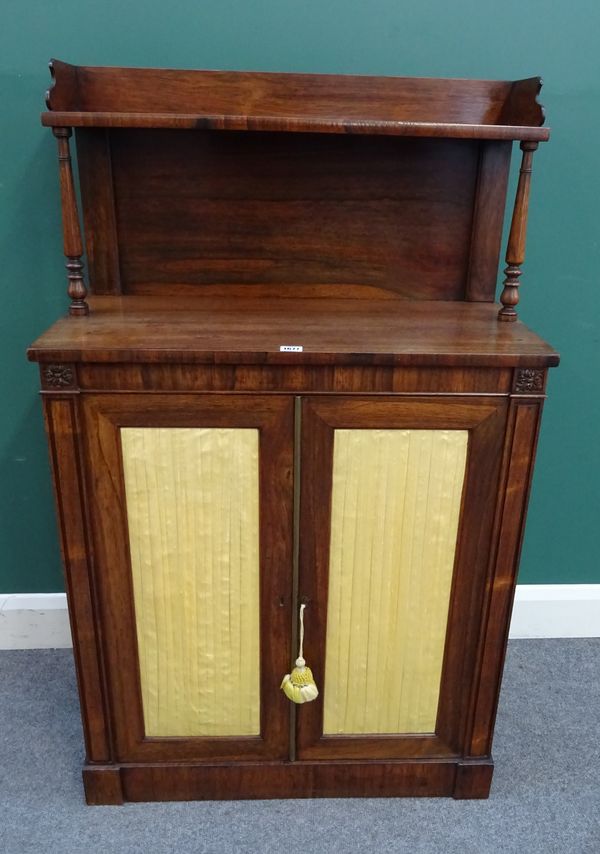 A William IV rosewood chiffonier, the galleried ledge back over pair of doors with pleated silk panels, 78cm wide x 125cm high x 36cm deep.  933