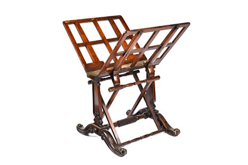 After a design by Holland & Son, a Victorian oak folio stand with adjustable lattice frame on trestle end standards and four downswept supports, 71cm