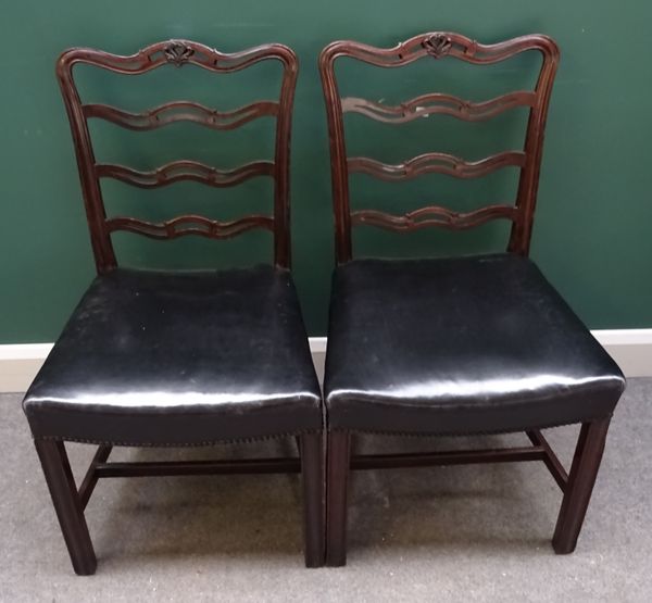 A set of fifteen George II style mahogany dining chairs, with pierced wavy splat and concave seat, on channelled square supports, (15). Note; these ch