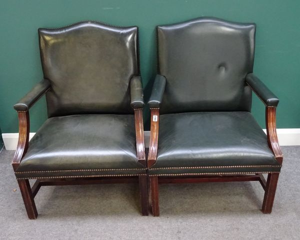 A pair of mid-18th century Gainsborough style chairs with studded green leather upholstery on channelled square supports. 71cm wide x 101cm high. (2)