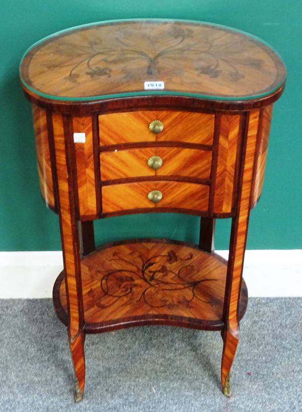 A Napoleon III marquetry inlaid kidney shaped three drawer side table, on shaped supports, united by platform undertier, 45cm wide x 75cm high x 30cm