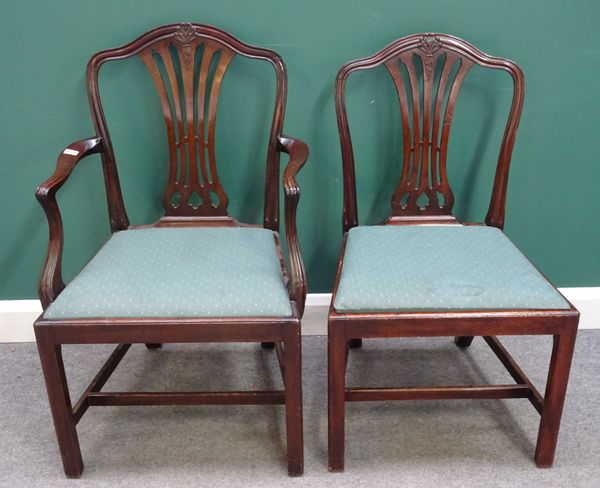 A set of fourteen mid-18th century style mahogany dining chairs, circa 1900, with hump crest and pierced splat on tapering square supports, to include