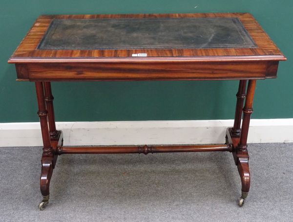 An early Victorian rosewood rectangular writing table, with single frieze drawer on turned supports united by stretcher, 100cm wide x 74cm high x 53cm