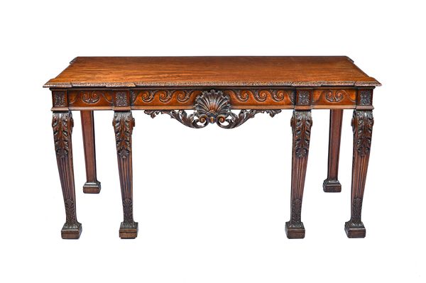 A mid-18th century style mahogany serving table, the rectangular top over shell carved frieze, on acanthus scroll channelled square supports, 169cm wi