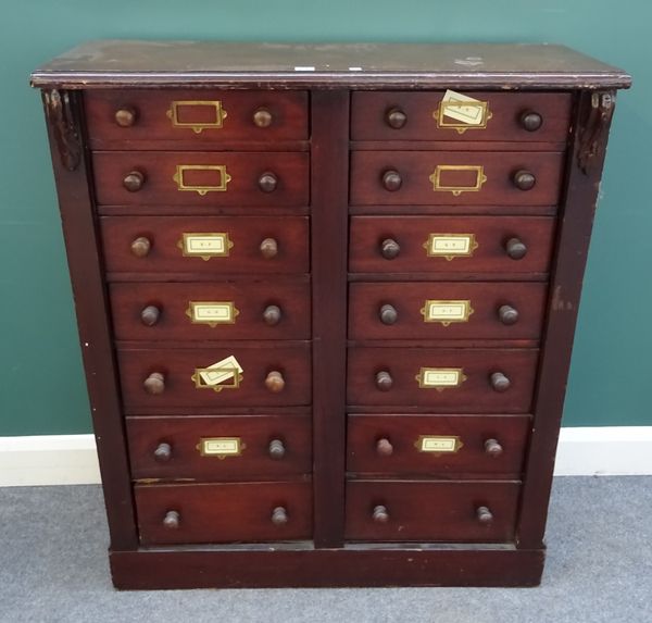 A late Victorian mahogany filing cabinet with two banks of seven long graduated drawers, 96cm wide x 114cm high x 35cm deep.