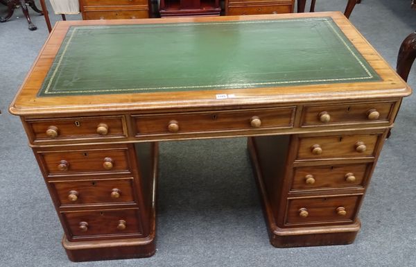 Edwards & Roberts Wardour St London; a late 19th century mahogany pedestal desk, with nine drawers about the knee, 123cm wide x 70cm deep x 74cm high.