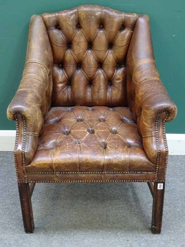 A George III style brown leather upholstered square back library chair, on channelled square supports, 75cm wide x 92cm high.