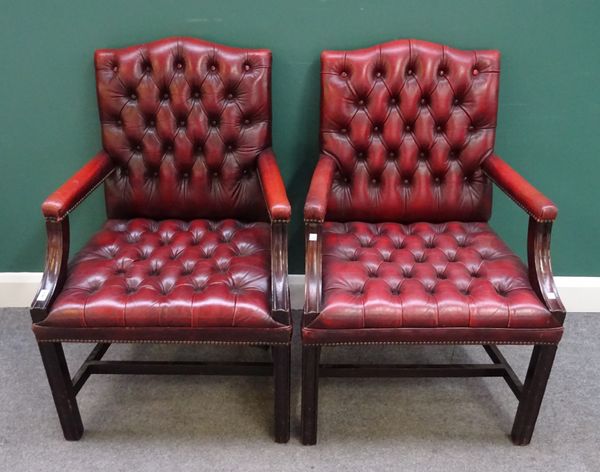 A pair of mid-18th century Gainsborough style chairs with studded red leather upholstery on channelled square supports. 66cm wide x 101cm high. (2)