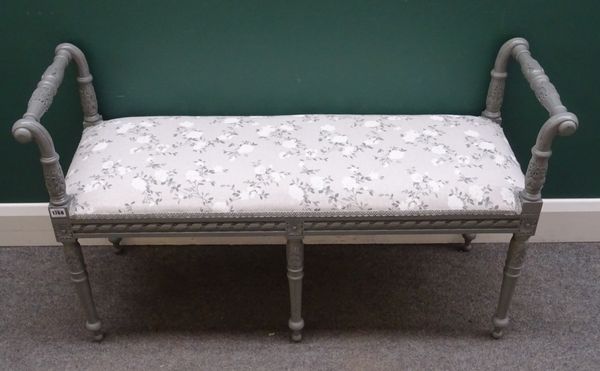 A Regency style window seat, the grey painted frame with turned and fluted supports and end stops, 114cm wide x 66cm high x 40cm deep.