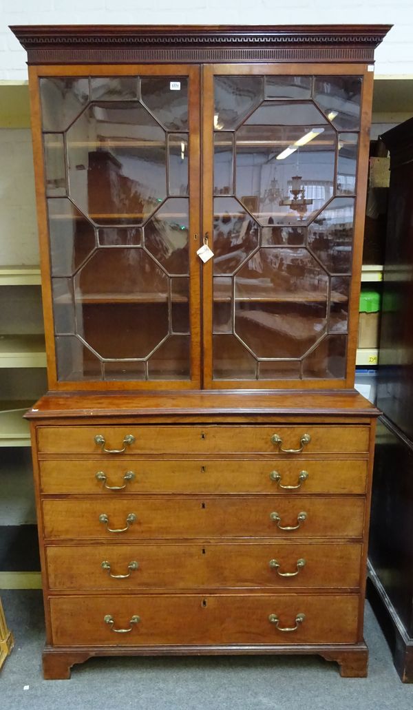 A George III mahogany bookcase chest, the pair of astragal glazed doors over fitted drawer and three long graduated drawers, on bracket feet, 119cm wi