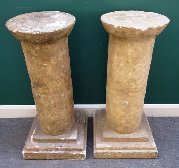 A pair of faux stone pedestals with circular top and column on stepped square base, 50cm wide x 104cm high. (2)