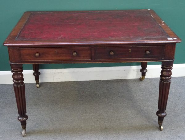 An early Victorian mahogany two drawer writing table, on tapering reeded supports, 122cm wide x 90cm deep x 77cm high.