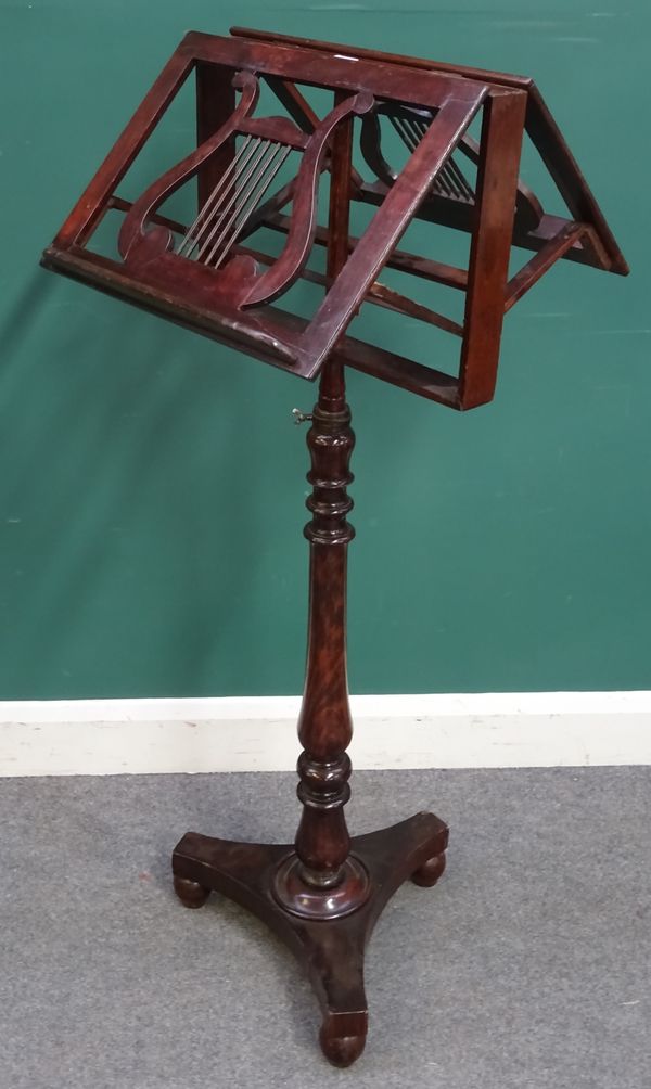 A Victorian mahogany height adjustable duet music stand with lyre decoration on turned column and quatrefoil platform, 42cm wide.