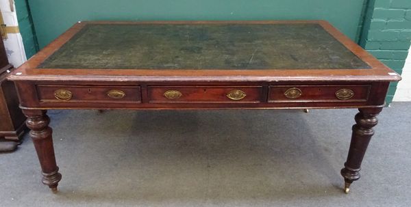 An early Victorian mahogany library centre table, with three frieze drawers and matching opposing, on turned supports, 181cm wide x 105cm deep x 73cm