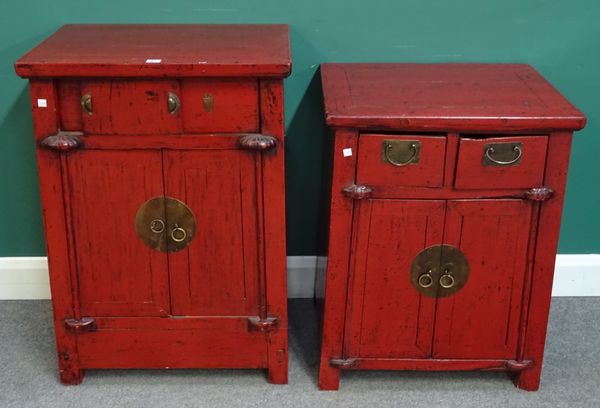 A pair of late 19th century Chinese scarlet lacquered side cabinets, each with pair of drawers over cupboards, 60cm wide x 76cm high x 47cm deep, (2).